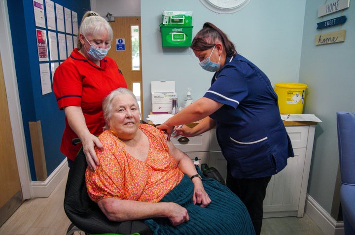 Care home resident Sylvia Everritt receiving her autumn Covid booster vaccination at Gorsey Clough Nursing Home, Tottington, Bury. 