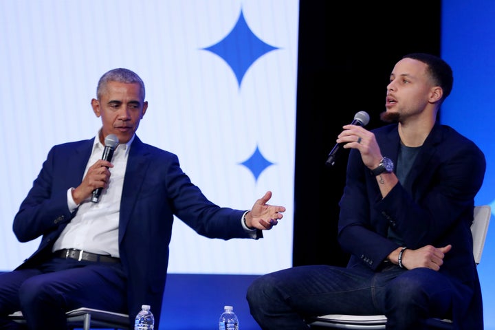 Barack Obama and Steph Curry share the stage at a 2019 summit.