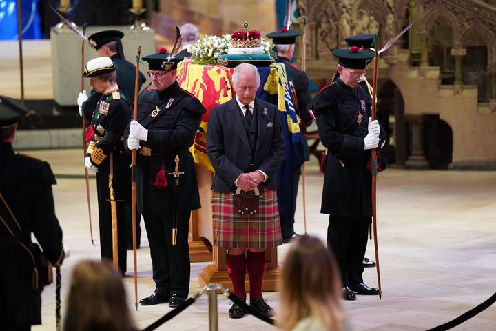 King Charles III, Prince Edward, Duke of Wessex, Princess Anne, Princes Royal and Prince Andrew, Duke of York hold a vigil at St Giles' Cathedral, in honour of Queen Elizabeth II as members of the public walk past.