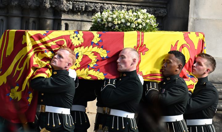 The coffin of Queen Elizabeth II is carried into St Giles Cathedral, after making its way along The Royal Mile on September 12, 2022 in Edinburgh, Scotland. 