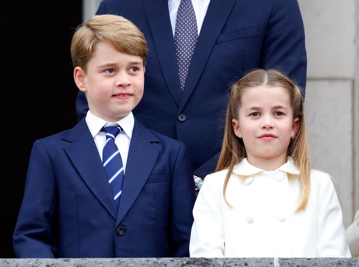 Prince George Princess Charlotte stand on the balcony of Buckingham Palace following the Platinum Pageant on June 5, 2022 in London, England.