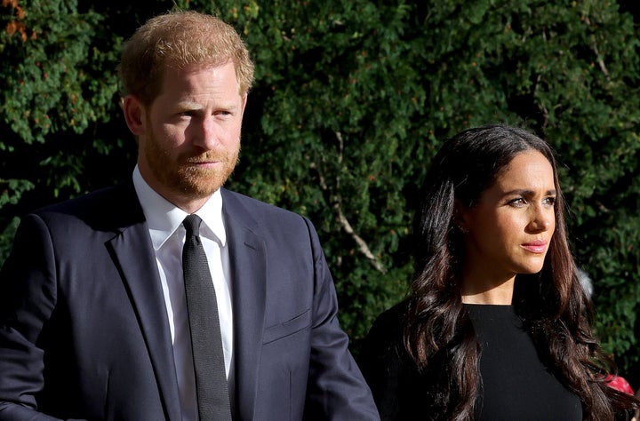 The Duke and Duchess of Sussex on the Long Walk to Windsor Castle in Windsor, England, to view flowers and tributes to Queen Elizabeth on Sept. 10.