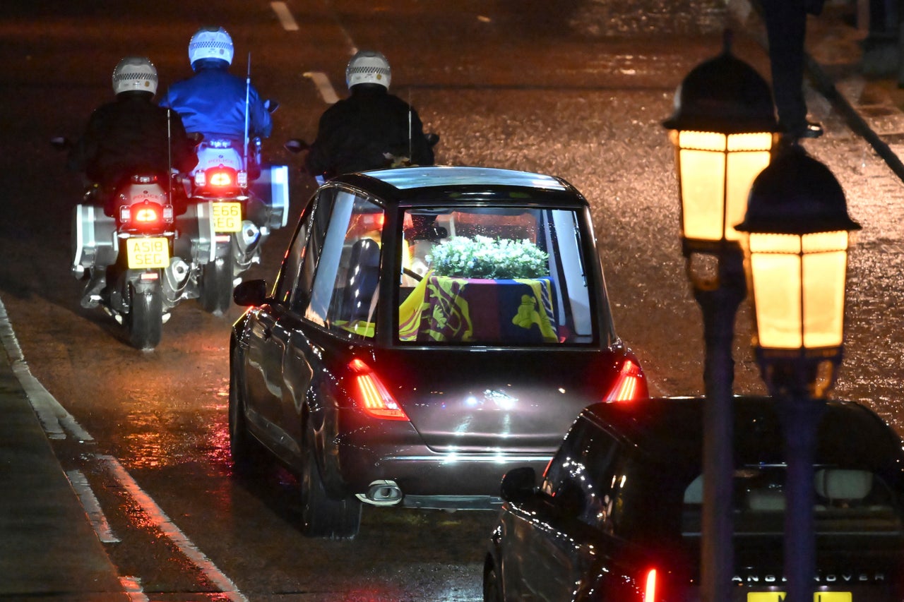 The coffin of Queen Elizabeth II in the royal hearse travels to the palace.