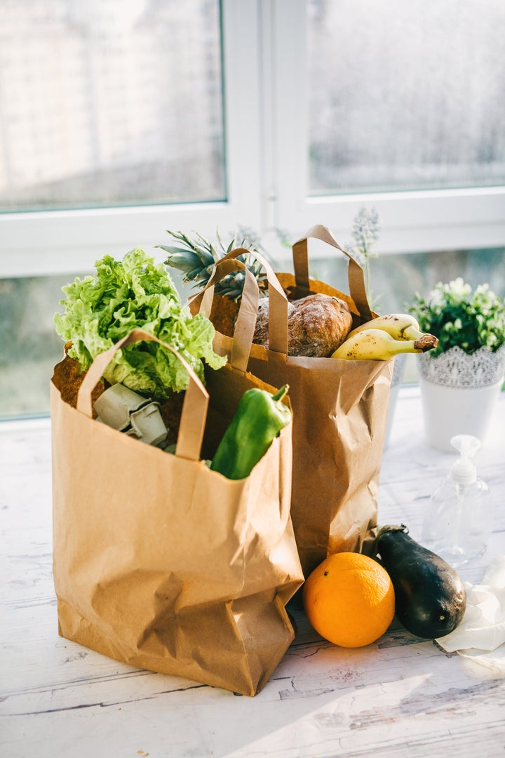 Two grocery bags on a kitchen counter