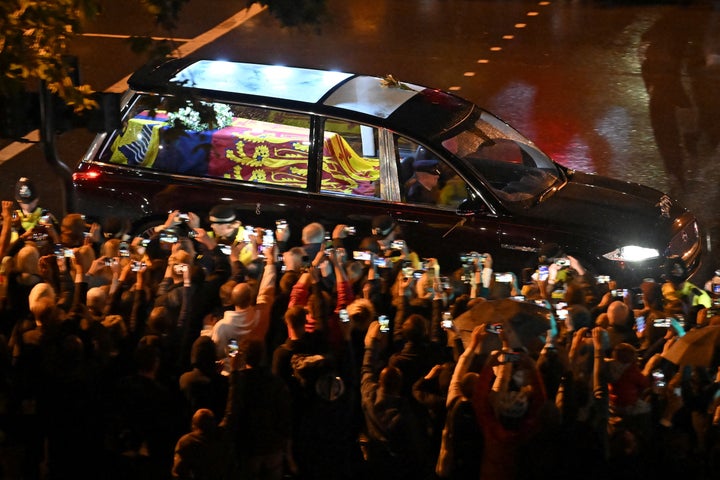 Seen from the top of the Wellington Arch, the coffin of Queen Elizabeth II is taken in the Royal Hearse to Buckingham Palace in London on September 13, 2022, following her death on September 8. MARCO BERTORELLO/Pool via REUTERS