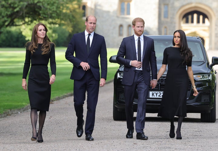 Catherine, Princess of Wales, Prince William, Prince of Wales, Prince Harry, Duke of Sussex, and Meghan, Duchess of Sussex on the long Walk at Windsor Castle arrive to view flowers and tributes to HM Queen Elizabeth on September 10, 2022 in Windsor, England. 