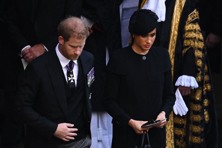 The Duke of Sussex and Duchess of Sussex leave after a service for the reception of Queen Elizabeth II's coffin at Westminster Hall.