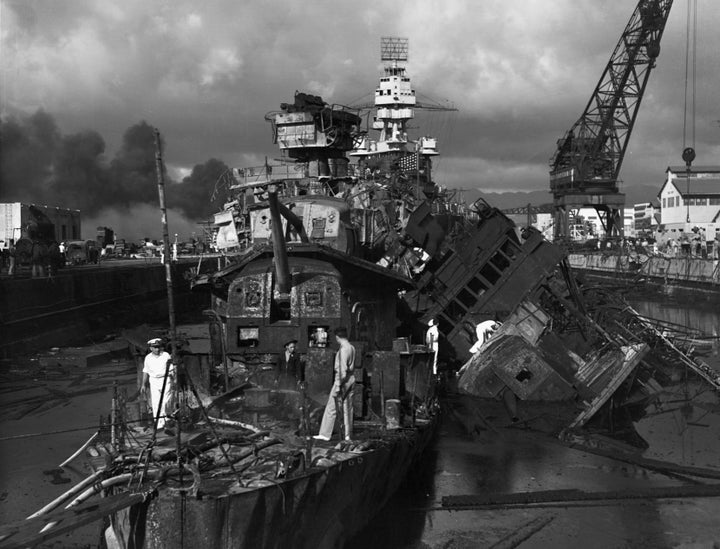 A mangled pile of metal is what was left of the USS Cassin, left, and the USS Downes, right, after the Japanese attack on Pearl Harbor. (Photo by © CORBIS/Corbis via Getty Images)