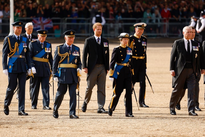 The British royal family, walking in union with military precision.