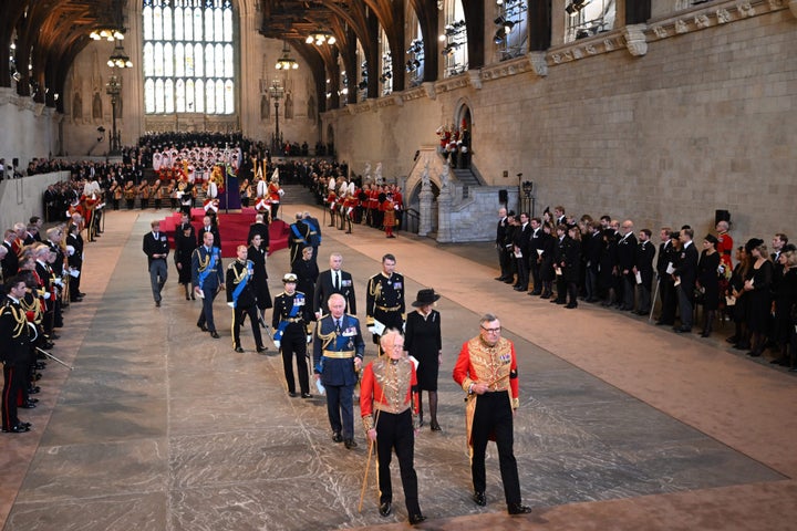 King Charles III leaves with Britain's Camilla, Queen Consort after a service for the reception of Queen Elizabeth II's coffin at Westminster Hall.