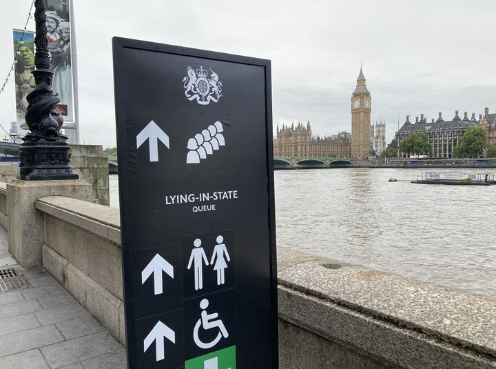Signage on the South Bank, London, for members of the public to wait in the queue to view Queen Elizabeth II lying in state ahead of her funeral on Monday.