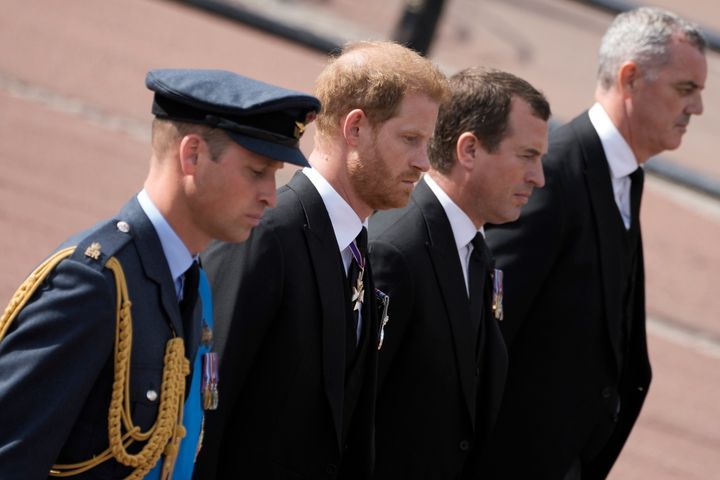 Prince William, left, and Prince Harry, second left, follow the coffin of Queen Elizabeth II. 