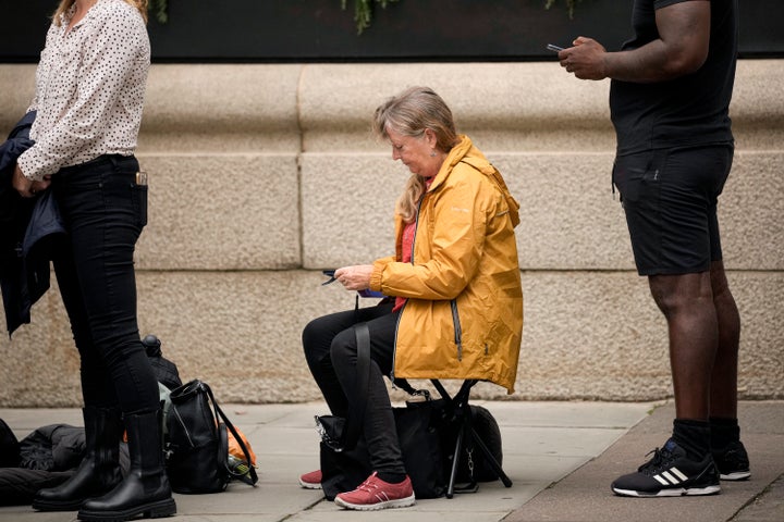 A woman sits as she waits to say farewell to Elizabeth on Wednesday.