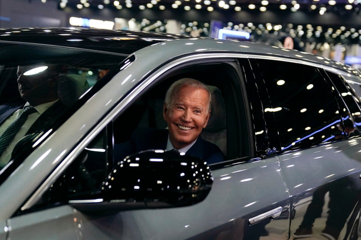 President Joe Biden drives a Cadillac Lyriq through the show room during a tour at the Detroit Auto Show, Wednesday, Sept. 14, 2022, in Detroit. (AP Photo/Evan Vucci)