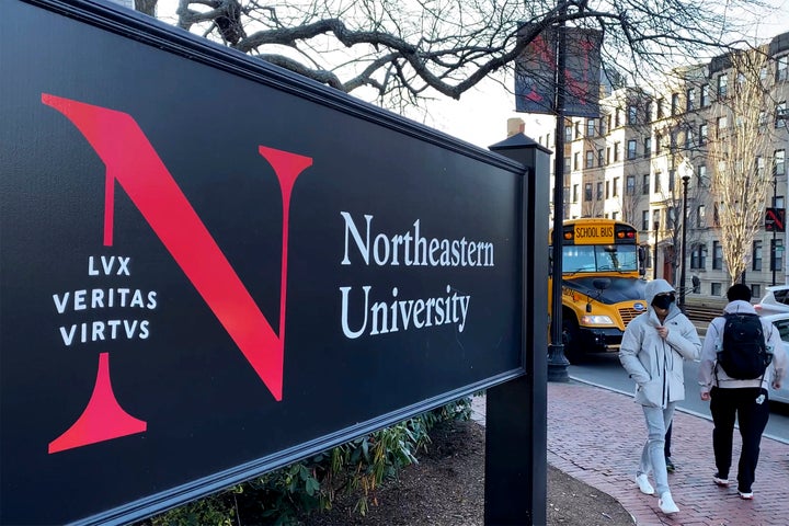 Students walk on the Northeastern University campus in Boston on Jan. 31, 2019. A police bomb squad sealed off part of the campus of Northeastern University late Tuesday, Sept. 13, 2022, to examine a pair of suspicious packages, and there were unconfirmed reports of an explosion and minor injuries to at least one person. (AP Photo/Rodrique Ngowi, File)