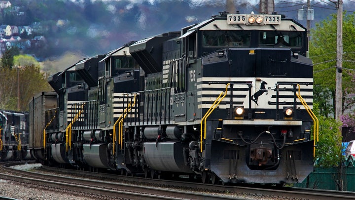 FILE - A Norfolk Southern freight train makes its way through Homestead, Pa., on April 27, 2022. Business and top officials are bracing for the possibility of a nationwide rail strike Friday, Sept. 16, 2022, while talks continue between the nation's largest freight railroads and their unions. (AP Photo/Gene J. Puskar, File)