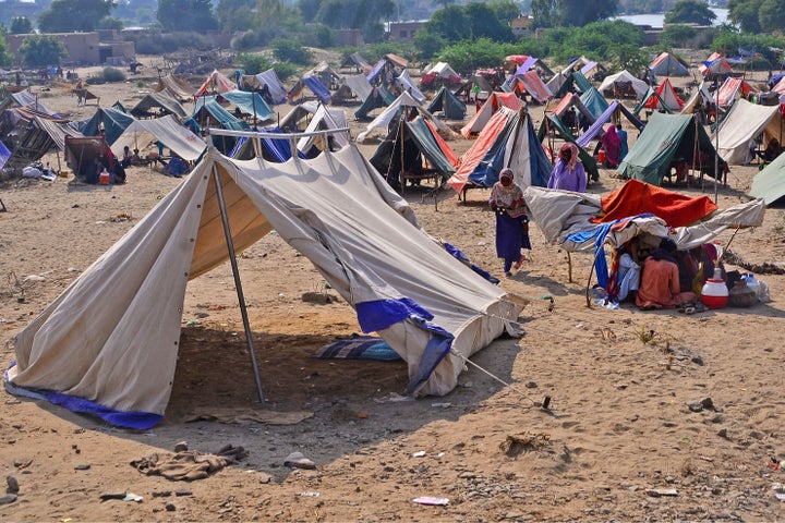 Internally displaced flood-affected people take refuge at a makeshift camp in Dadu district of Sindh province on Wednesday.