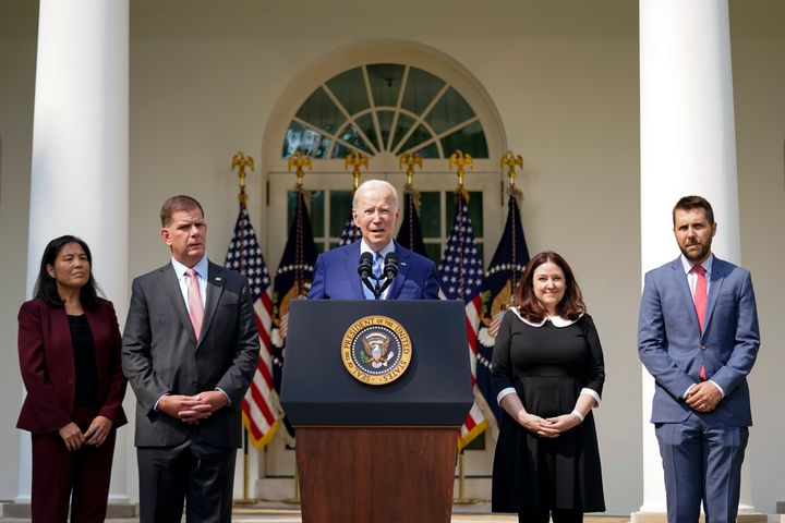 President Joe Biden speaks about a tentative railway labor agreement in the Rose Garden of the White House, Thursday, Sept. 15, 2022, in Washington. From left, Deputy Secretary of Labor Julie Su, Secretary of Labor Marty Walsh, Biden, Celeste Drake, Made in America Director at the Office of Management and Budget, and National Economic Council director Brian Deese. (AP Photo/Andrew Harnik)
