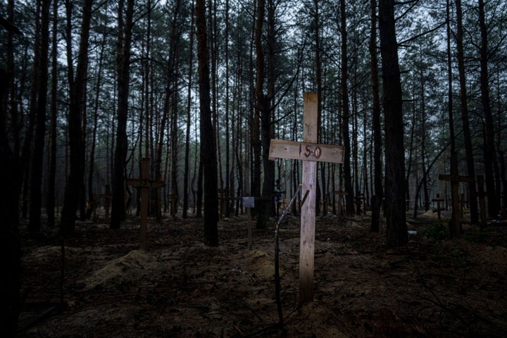 A mass grave of Ukrainian soldiers and unknown buried civilians was found in the forest of recently recaptured city of Izium.