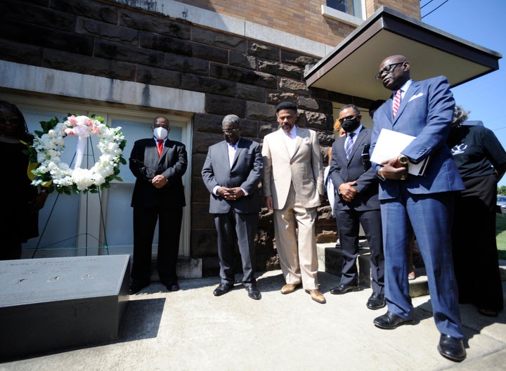 Leaders pray outside 16th Street Baptist Church in Birmingham, Ala., on Sept. 15, 2022, at the spot where a Ku Klux Klan bomb went off in 1963, killing four Black girls. 