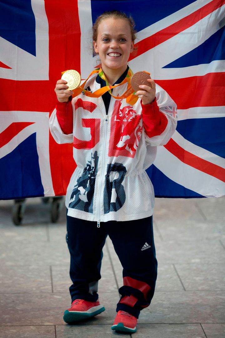 Ellie posing with her gold medals after her wins in Rio back in 2016