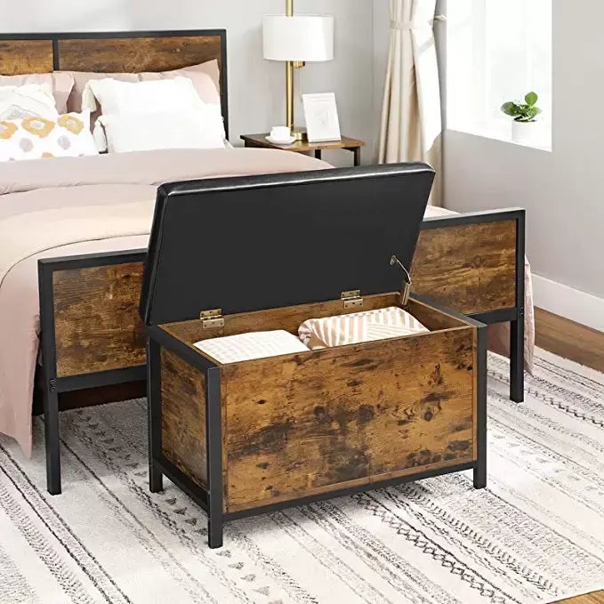 A <a href="https://www.amazon.com/VASAGLE-COPADION-Supports-Industrial-ULSC80BX/dp/B07XY233G9?tag=griffinwynne-20&ascsubtag=632486c3e4b0eac9f4e1459e%2C-1%2C-1%2Cd%2C0%2C0%2Chp-fil-am%3D0%2C0%3A0%2C0%2C0%2C0" target="_blank" role="link" data-amazon-link="true" rel="sponsored" class=" js-entry-link cet-external-link" data-vars-item-name="bed storage trunk to hold your off-season clothes" data-vars-item-type="text" data-vars-unit-name="632486c3e4b0eac9f4e1459e" data-vars-unit-type="buzz_body" data-vars-target-content-id="https://www.amazon.com/VASAGLE-COPADION-Supports-Industrial-ULSC80BX/dp/B07XY233G9?tag=griffinwynne-20&ascsubtag=632486c3e4b0eac9f4e1459e%2C-1%2C-1%2Cd%2C0%2C0%2Chp-fil-am%3D0%2C0%3A0%2C0%2C0%2C0" data-vars-target-content-type="url" data-vars-type="web_external_link" data-vars-subunit-name="article_body" data-vars-subunit-type="component" data-vars-position-in-subunit="0">bed storage trunk to hold your off-season clothes</a>.