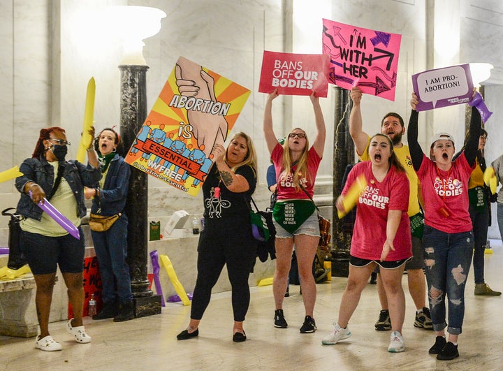 Abortion rights supporters demonstrate outside the state Senate chamber at the West Virginia Capitol on Tuesday.