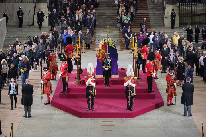 King Charles III, the Princess Royal, the Duke of York and the Earl of Wessex hold a vigil beside the coffin of their mother, Queen Elizabeth II, as it lies in state on the catafalque in Westminster Hall.
