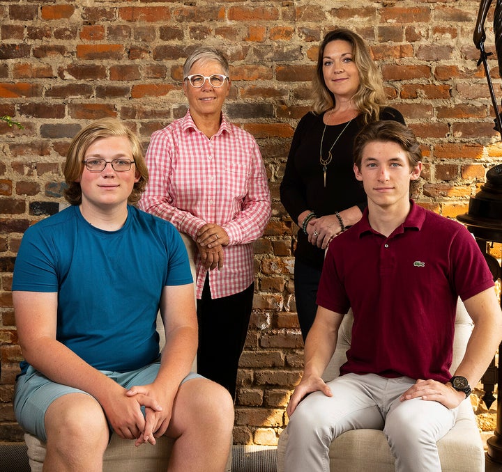 Erin Porterfield, back left, and Kristin Williams, back right, along with their children, Cameron Porter Williams, 16, front left, and Kadin Porter Williams, 18, pose for a photograph at Omaha family law firm Koenig | Dunne in Omaha, Nebraska, on Wednesday, Aug. 4, 2021 in Omaha, Neb. (Photo by Rebecca S. Gratz for ACLU of Nebraska via AP).