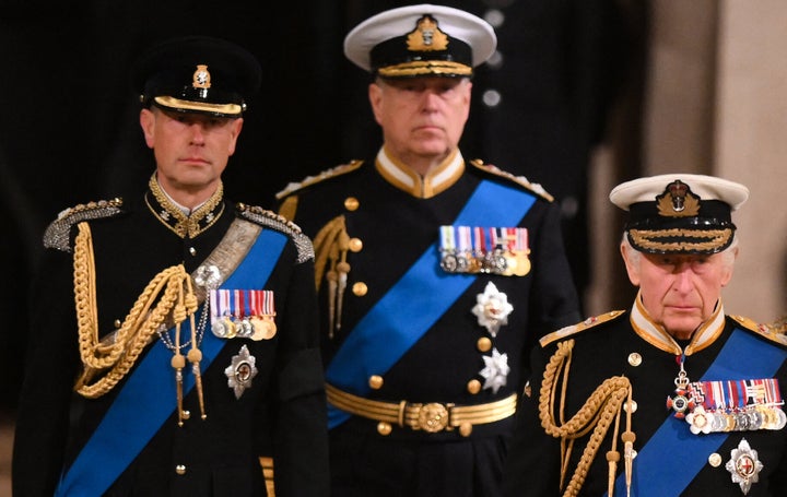 Britain's King Charles III (front R), Britain's Prince Andrew, Duke of York, and Britain's Prince Edward, Earl of Wessex arrive to mount a vigil around the coffin of Queen Elizabeth II.