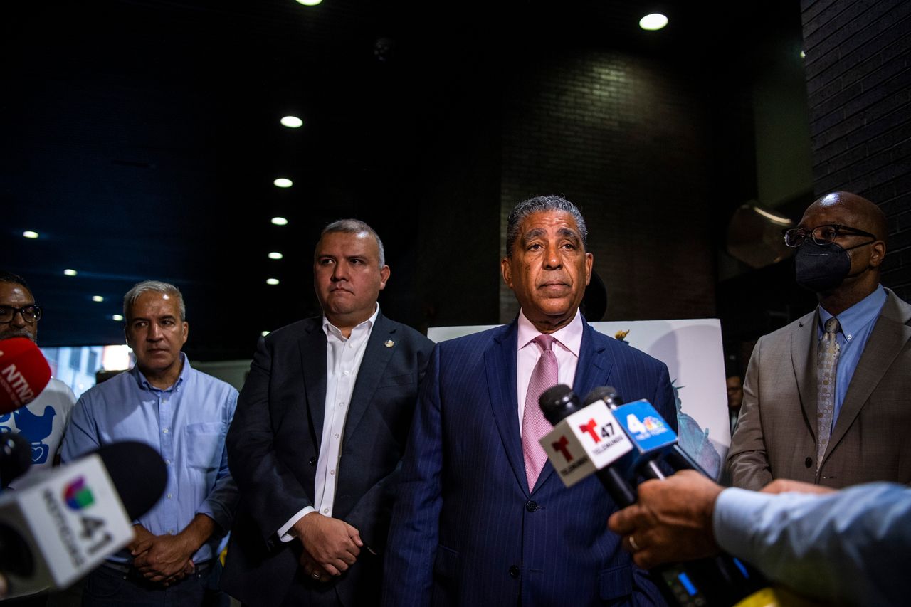Left to right: Commissioner Manuel Castro, Rep. Adriano Espaillat (D-N.Y.), and Commissioner Gary Jenkins speak to press after the arrival of asylum seekers on Sept. 9, 2022.