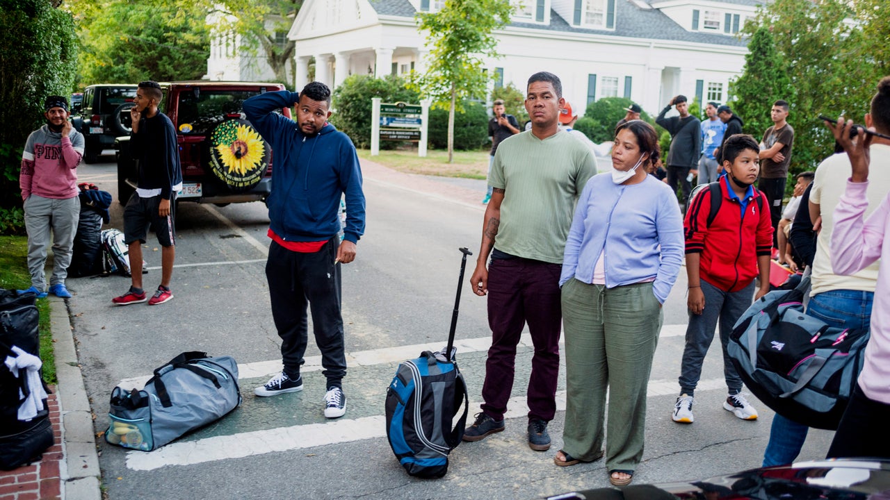 Immigrants gather with their belongings outside St. Andrews Episcopal Church, Wednesday Sept. 14, 2022, in Edgartown, Mass., on Martha's Vineyard. Florida Gov. Ron DeSantis on Wednesday flew two planes of immigrants to Martha's Vineyard, escalating a tactic by Republican governors to draw attention to what they consider to be the Biden administration's failed border policies.