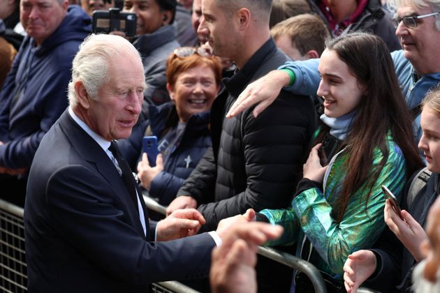 Britain's King Charles greets people queueing to pay their respects to Britain's Queen Elizabeth following her death, in London, Britain, September 17, 2022. REUTERS/Phil Noble