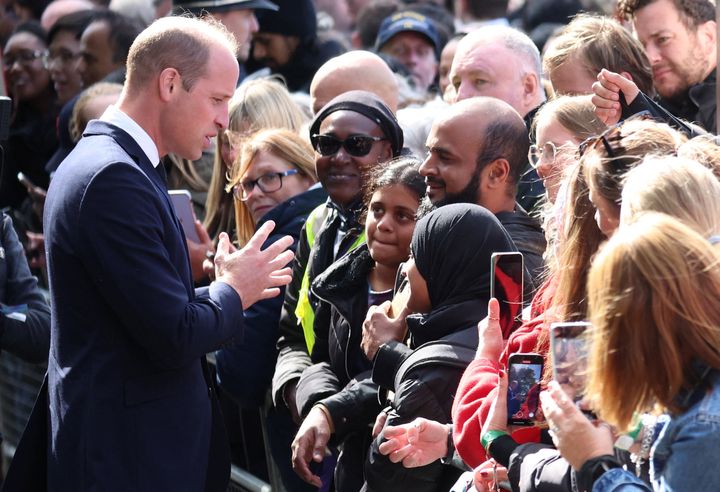 Britain's William, Prince of Wales greets people queueing to pay their respects to Britain's Queen Elizabeth following her death, in London, Britain, September 17, 2022. REUTERS/Phil Noble