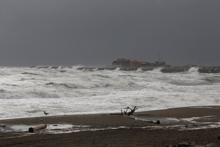 Waves from the Bering Sea splash up on a jetty on Friday, Sept. 16, 2022, in Nome, Alaska. Much of Alaska's western coast could see flooding and high winds as the remnants of Typhoon Merbok moved into the Bering Sea region.