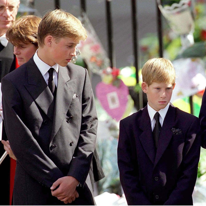 Prince William and Prince Harry stand outside Westminster Abbey at the funeral of Diana, Princess of Wales on September 6, 1997 in London, England.