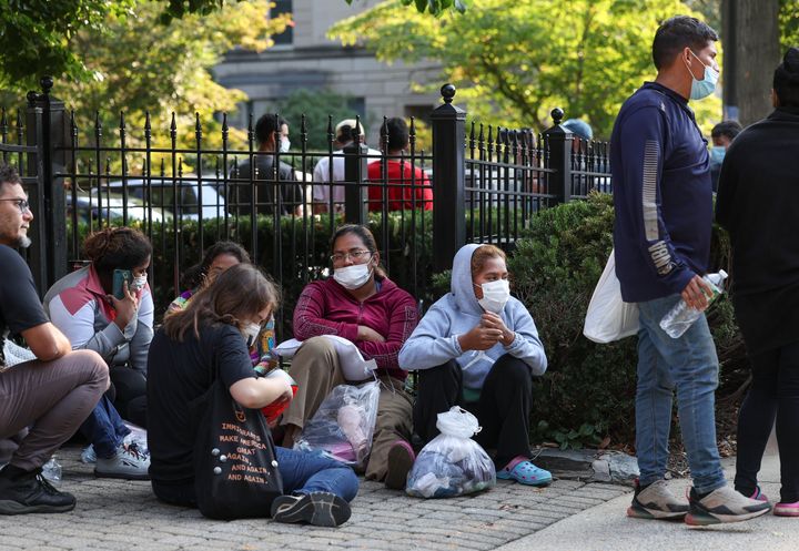 WASHINGTON, DC: Migrants wait near the residence of Vice President Kamala Harris on Thursday.