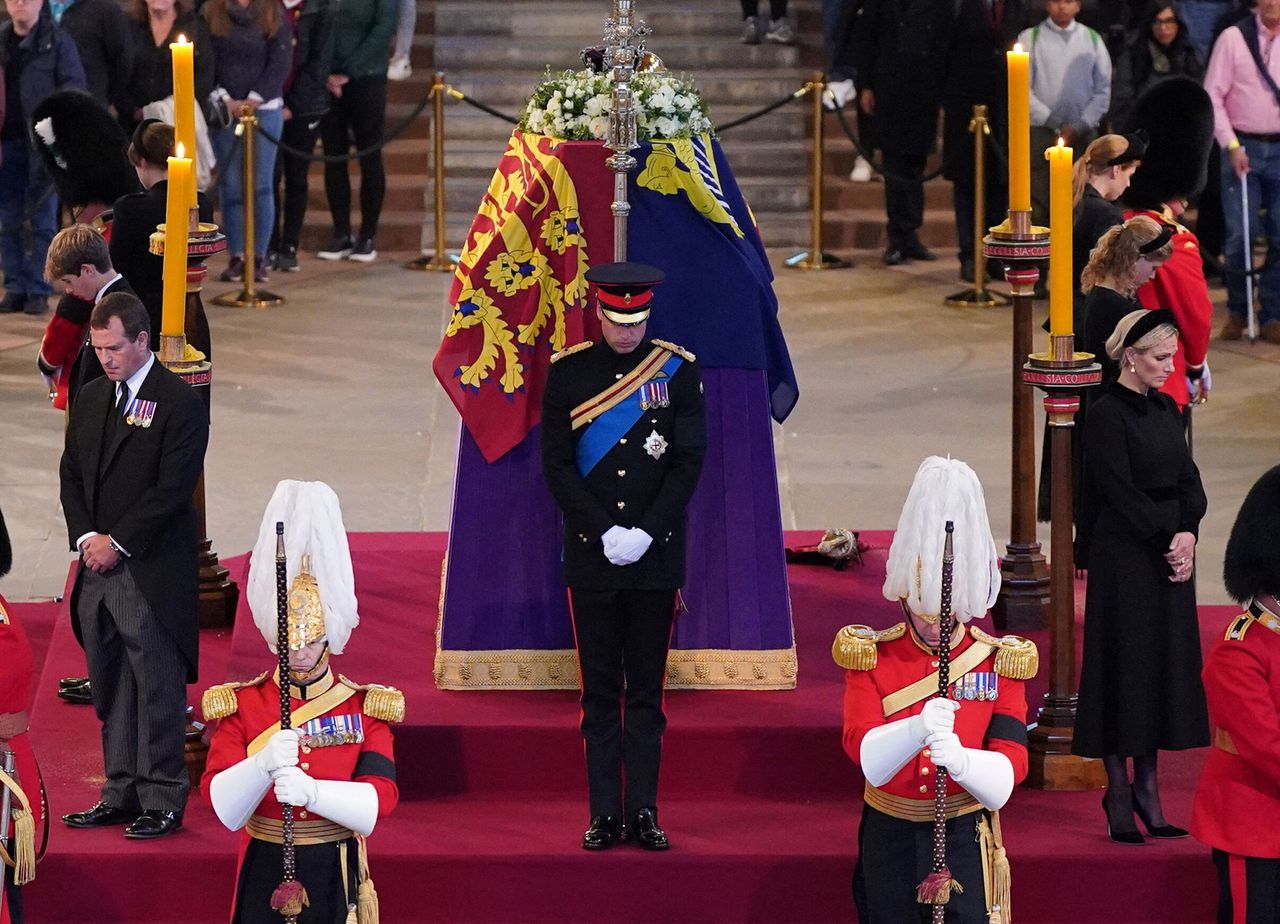 Queen Elizabeth II 's grandchildren (clockwise from front centre) the Prince of Wales, Peter Phillips, James, Viscount Severn, Princess Eugenie, the Duke of Sussex (not seen), Princess Beatrice, Lady Louise Windsor and Zara Tindall hold a vigil beside the coffin of their grandmother as it lies in state on the catafalque in Westminster Hall, at the Palace of Westminster, London. Picture date: Saturday September 17, 2022. Yui Mok/Pool via REUTERS