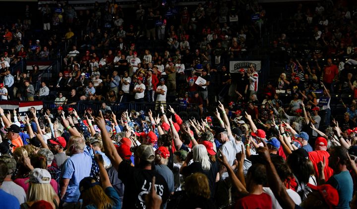 Donald Trump disciples raise a disturbing stiff-armed one-fnger salute to the former president at his his Ohio rally Saturday night.