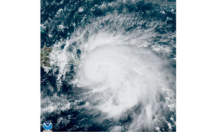 This satellite image provided by NOAA shows Hurricane Fiona in the Caribbean on Sunday, Sept. 18, 2022. The eye of newly formed Hurricane Fiona is near the coast of Puerto Rico — and it has already sparked an island-wide blackout and threatens to dump “historic” levels of rain. (NOAA via AP)
