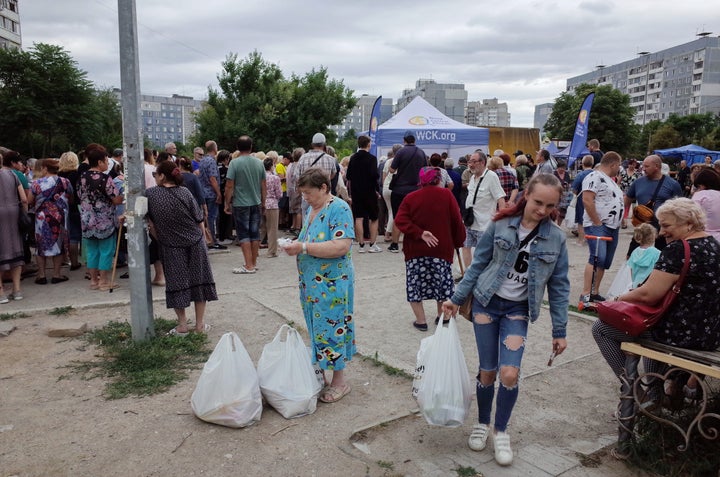 People receiving humanitarian aid in June in Zaporizhzhya, Ukraine, near the largest nuclear plant in Europe.