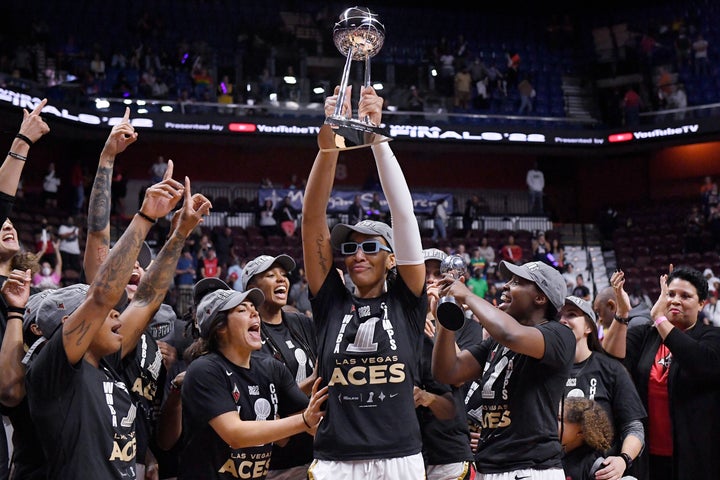 Las Vegas Aces' A'ja Wilson holds up the championship trophy as the team won the WNBA basketball finals against the Connecticut Sun.