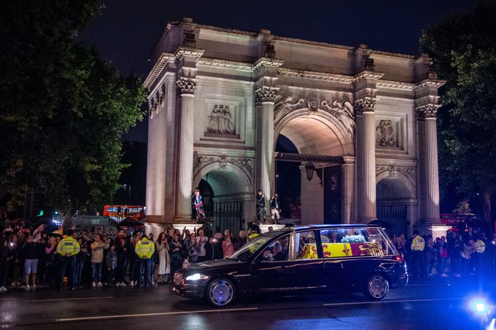 The royal hearse carrying the coffin of Queen Elizabeth II drives past Wellington Arch on September 13, 2022 in London, England. 