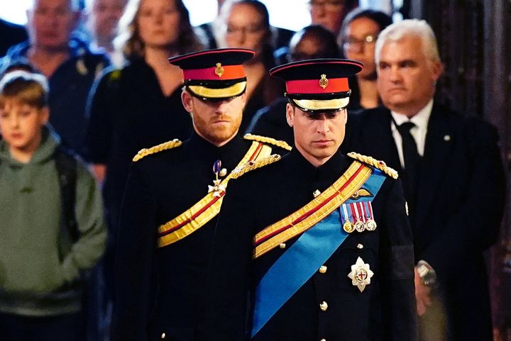 Queen Elizabeth II 's grandchildren (L-R) Prince Harry and Prince William arrive to hold a vigil around the coffin of Queen Elizabeth II, in Westminster Hall on Sep. 17. 