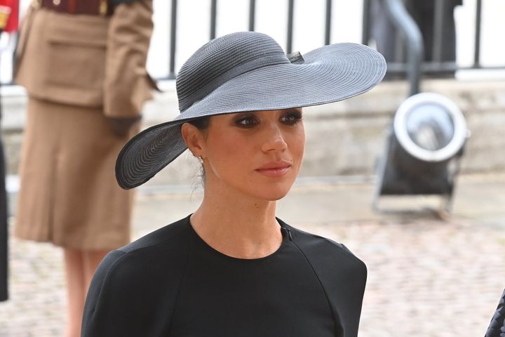 Meghan, Duchess of Sussex walks behind The Queen's funeral cortege