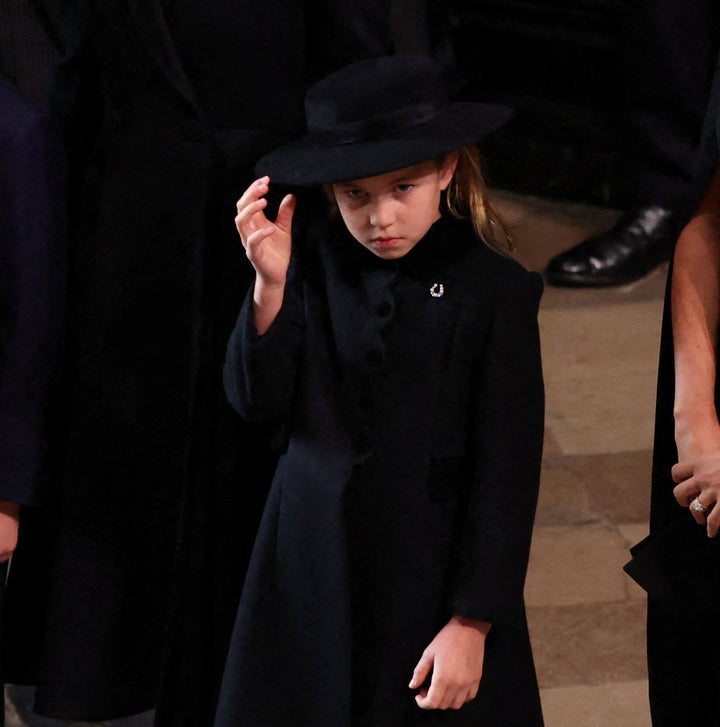 A close up of Princess Charlotte at the state funeral. The princess wore a wide-brimmed black hat, like her mother.