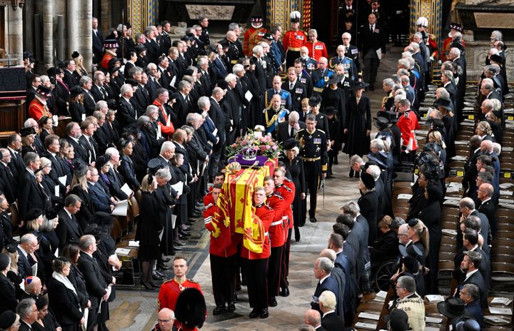 The royal family follows behind the coffin of Queen Elizabeth II as it departs Westminster Abbey.
