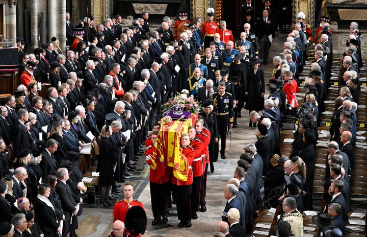 The royal family follows behind the coffin of Queen Elizabeth II as it departs Westminster Abbey.