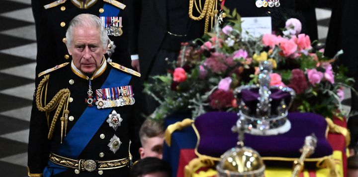 Britain's King Charles III walks behind the coffin of Britain's Queen Elizabeth II.