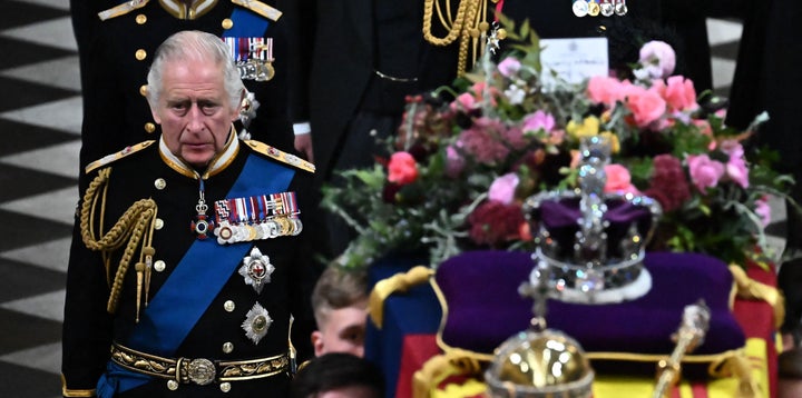 Britain's King Charles III walks behind the coffin of Britain's Queen Elizabeth II.